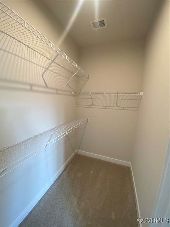 14031 Millpointe Road, Unit 15C Midlothian, VA 23114 - Photo 9 of 17 a view of a room with racks on the wall