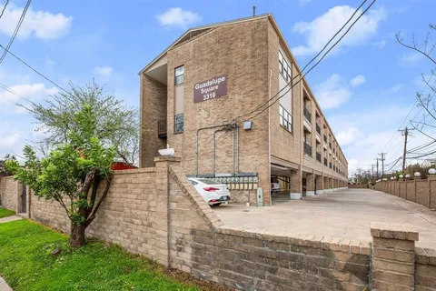 a view of a building with a yard