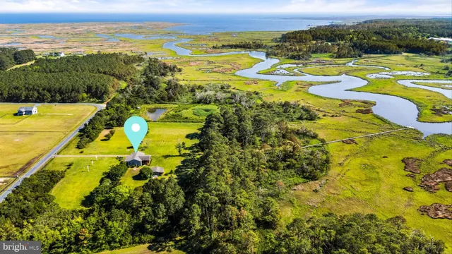 a view of a roof deck with lake view and wooden floor