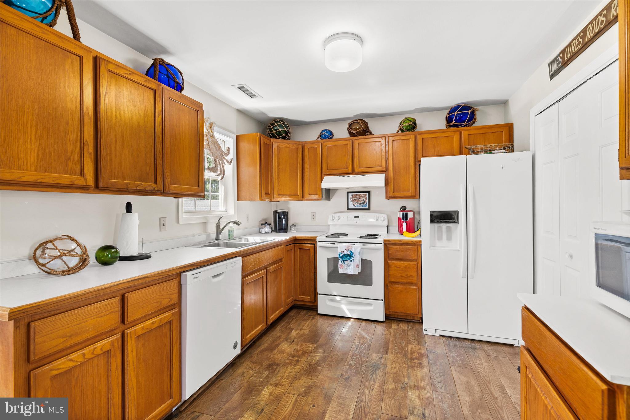 3620 Country Club Road Crisfield, MD 21817 - Photo 17 of 62 a kitchen with stainless steel appliances granite countertop a refrigerator and a stove top oven