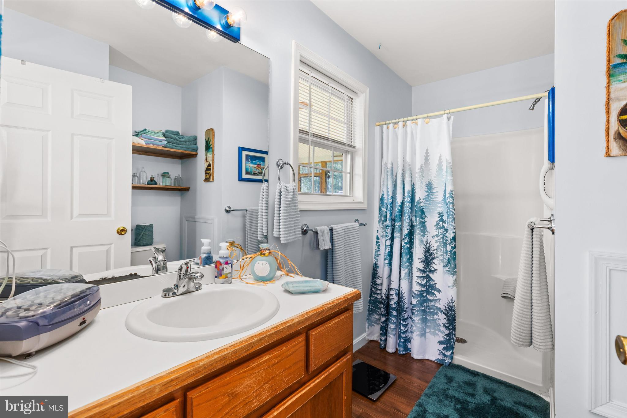 3620 Country Club Road Crisfield, MD 21817 - Photo 26 of 62 a bathroom with a sink and a mirror