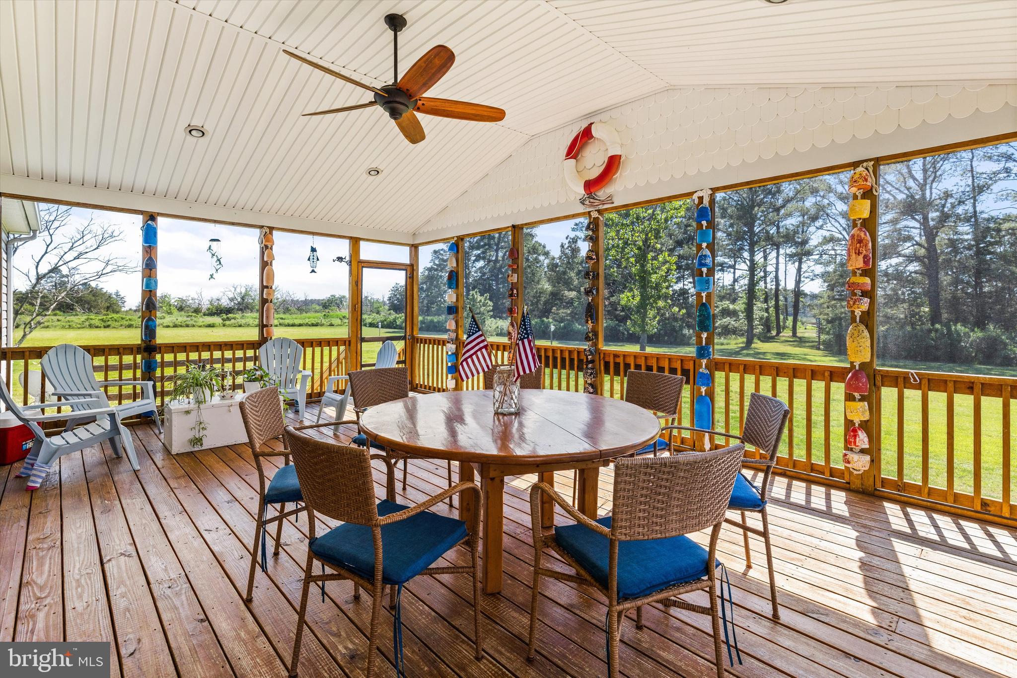 3620 Country Club Road Crisfield, MD 21817 - Photo 3 of 62 a dining room with furniture large windows and wooden floor
