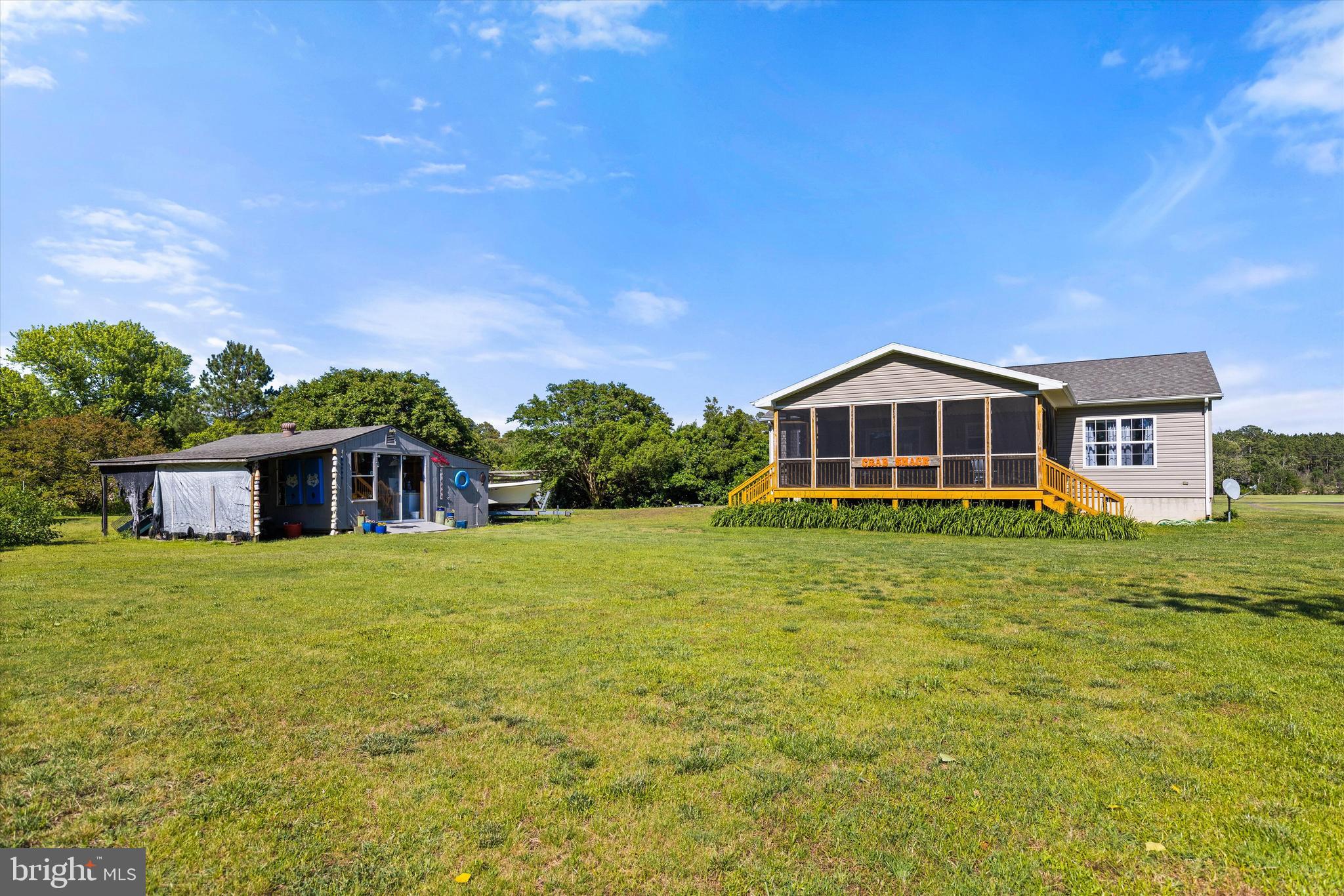 3620 Country Club Road Crisfield, MD 21817 - Photo 32 of 62 a front view of a house with a yard