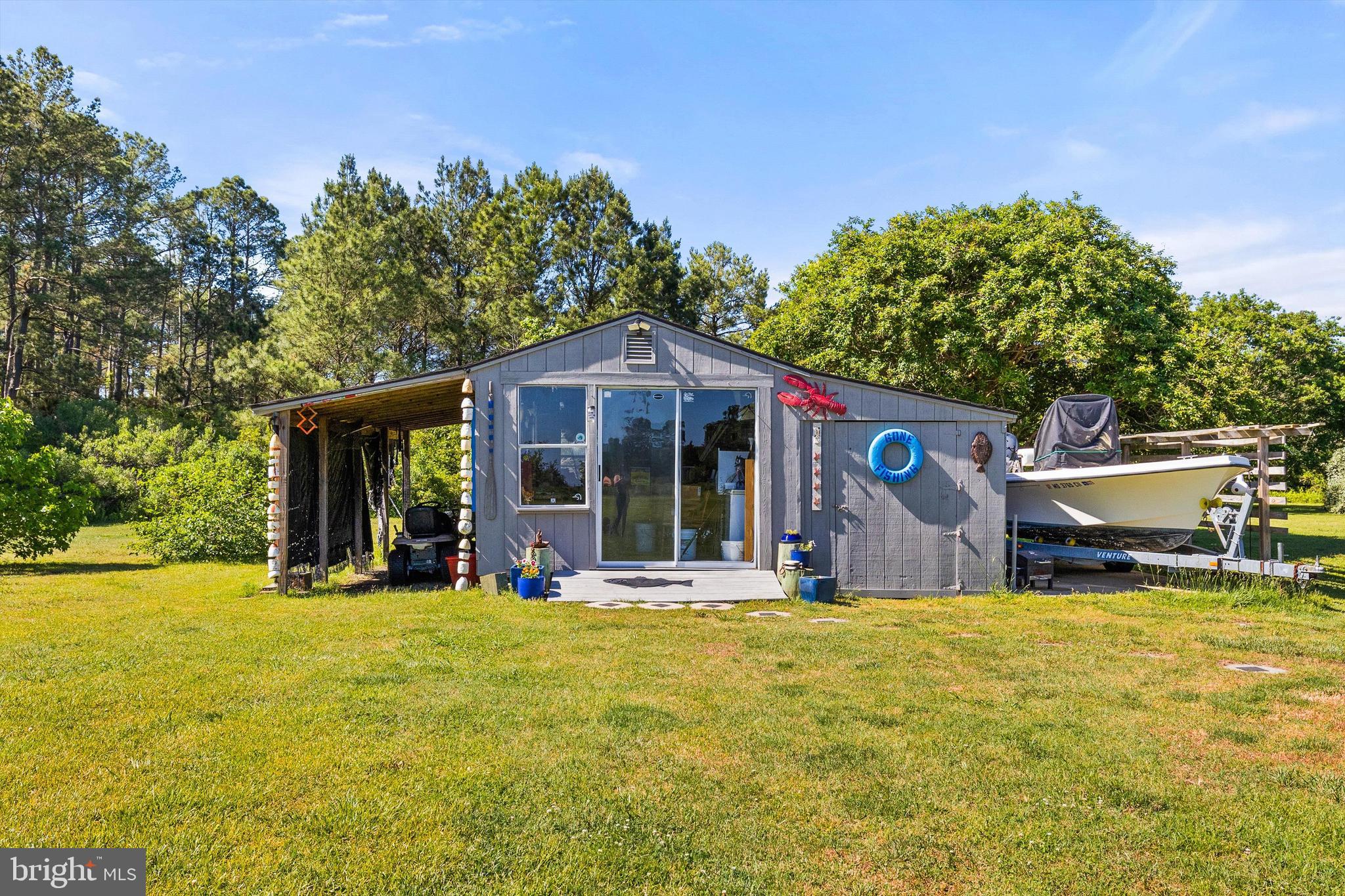 3620 Country Club Road Crisfield, MD 21817 - Photo 33 of 62 a front view of a house with a yard