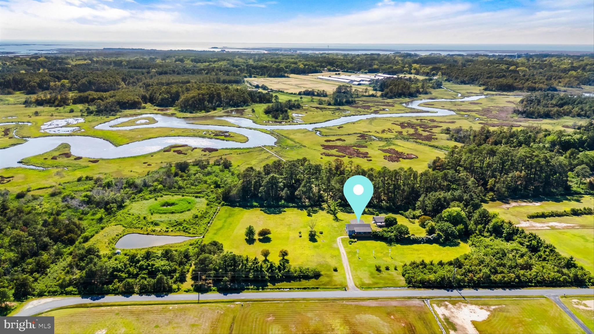 3620 Country Club Road Crisfield, MD 21817 - Photo 50 of 62 a view of a swimming pool with an outdoor space and seating area