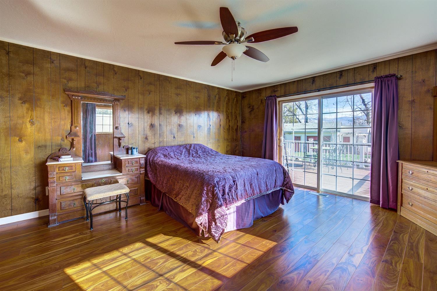 4149 Hilsinger Road Phoenix, OR 97535 - Photo 23 of 35 a spacious bedroom with a bed and a large window