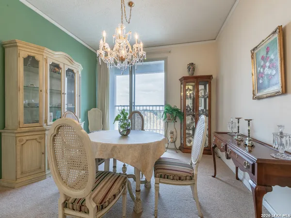 a view of a dining room with furniture window and outside view
