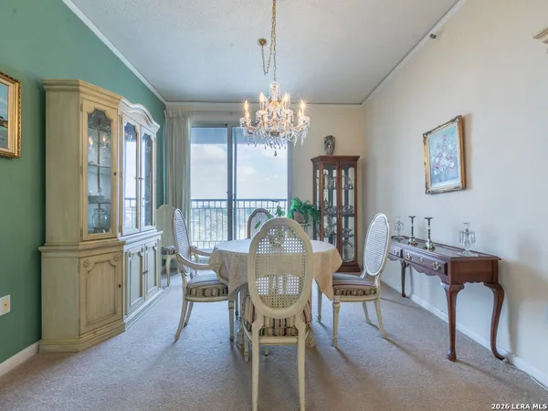 a view of a dining room with furniture window and outside view