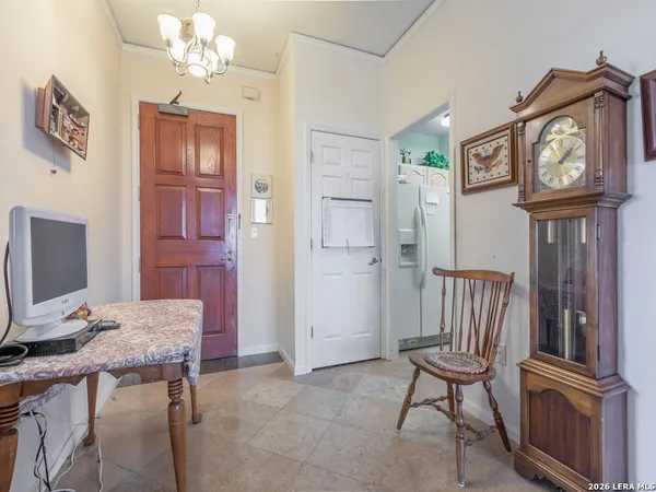 a view of a hallway with seating area