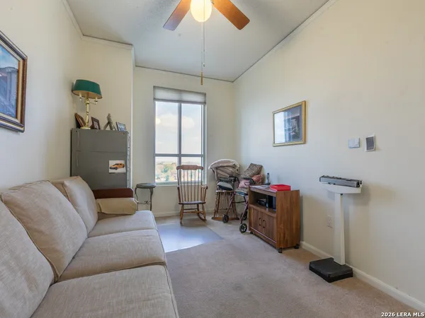a living room with furniture and a window