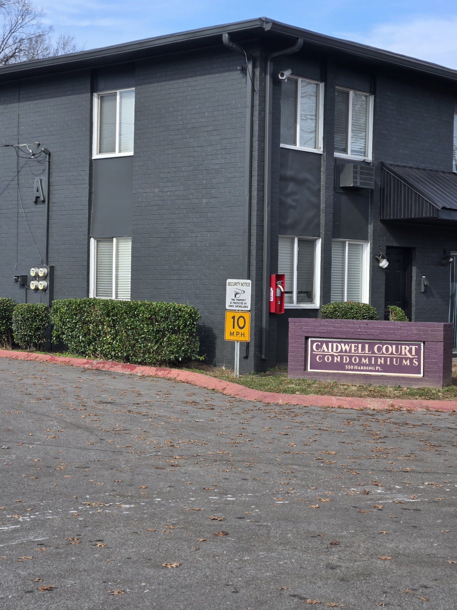 a sign board on the side of a building