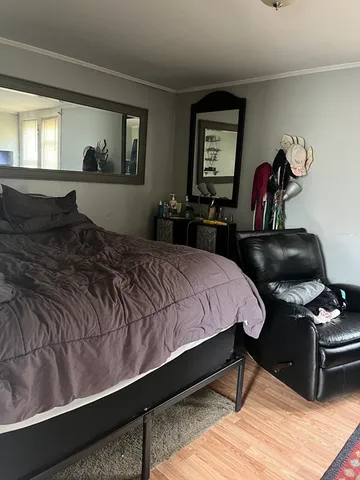 a bedroom with a bed and window