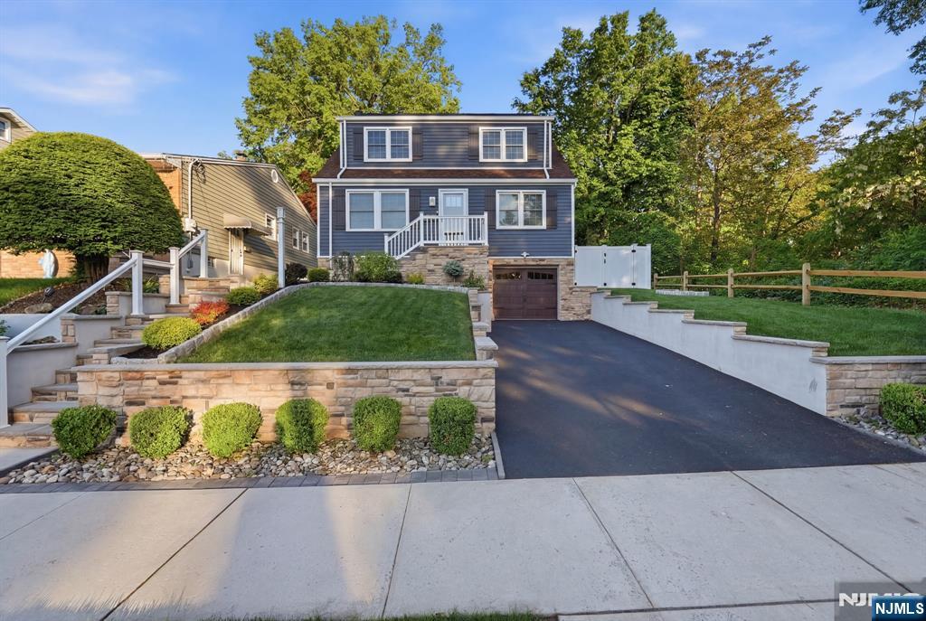 44 Alpine Place Kearny, NJ 07032 - Photo 3 of 50 a front view of a house with a yard and potted plants