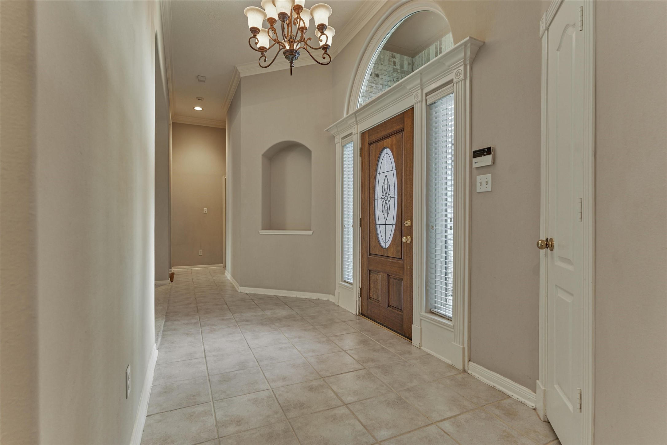 930 Arbor Pine Tomball, TX 77375 - Photo 11 of 45 an empty room with chandelier front door