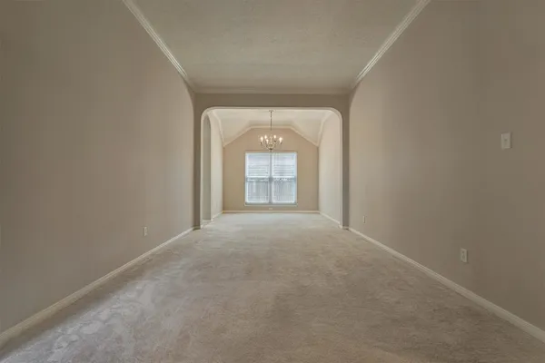a view of a chandelier in big room and chandelier