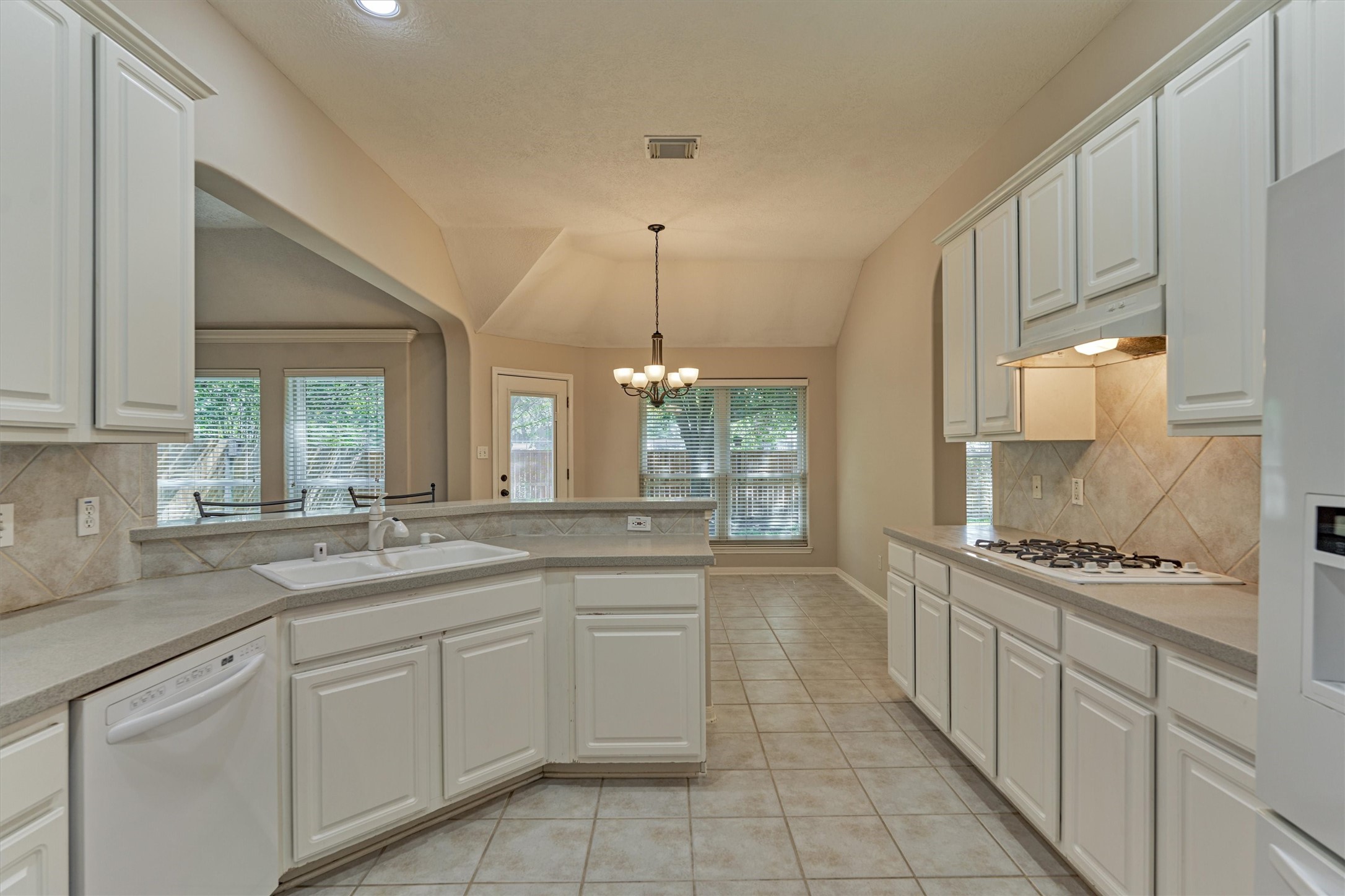 930 Arbor Pine Tomball, TX 77375 - Photo 25 of 45 a kitchen with stainless steel appliances a sink stove and cabinets
