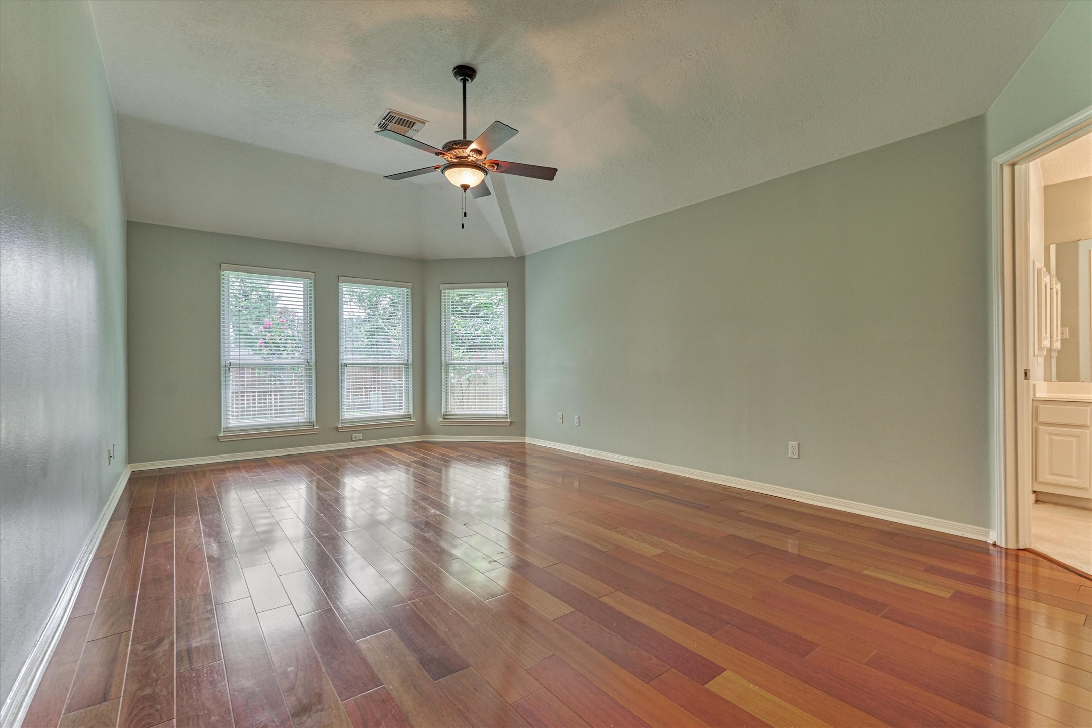 930 Arbor Pine Tomball, TX 77375 - Photo 26 of 45 a view of an empty room with wooden floor and a window