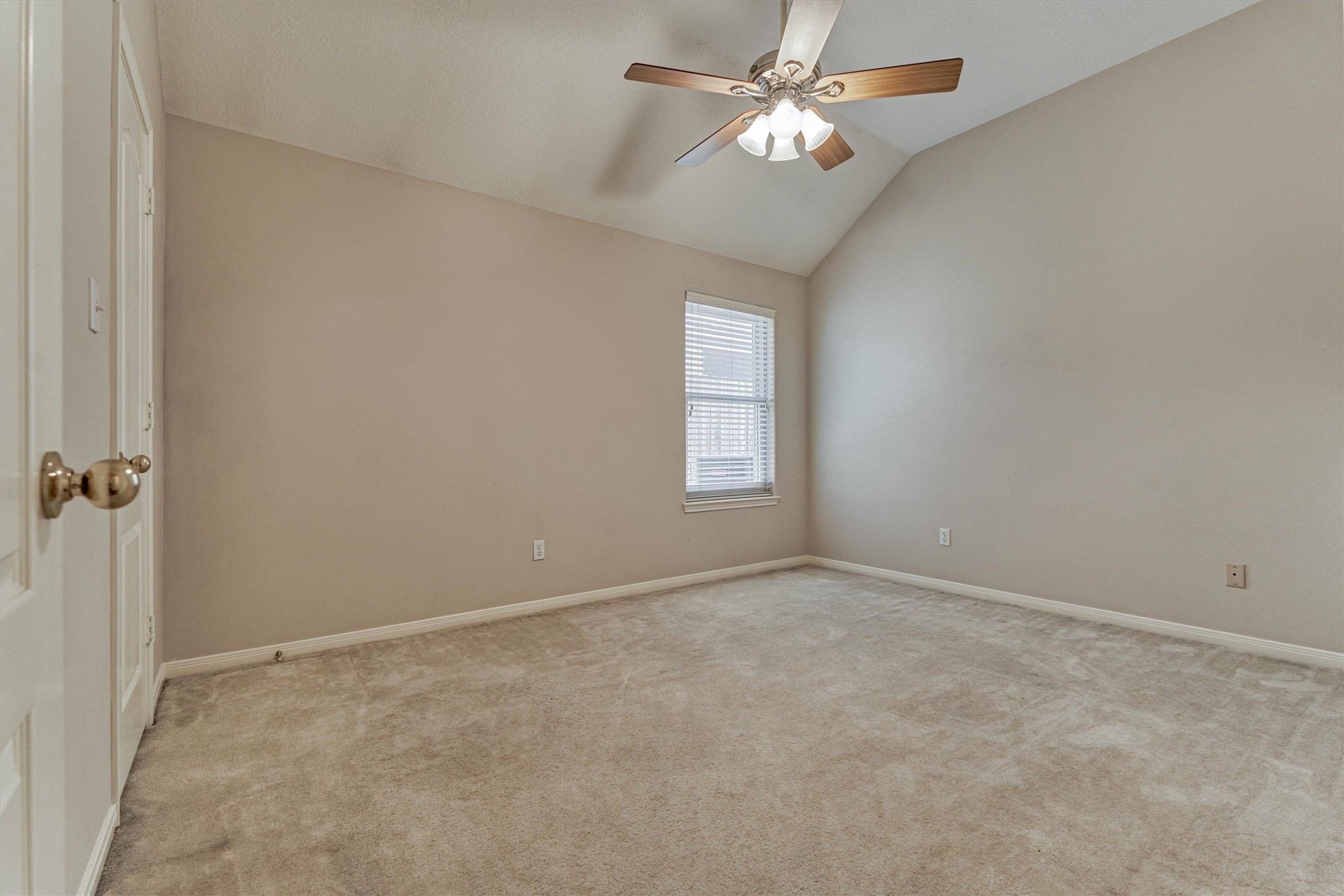 930 Arbor Pine Tomball, TX 77375 - Photo 33 of 45 an empty room with windows and fan