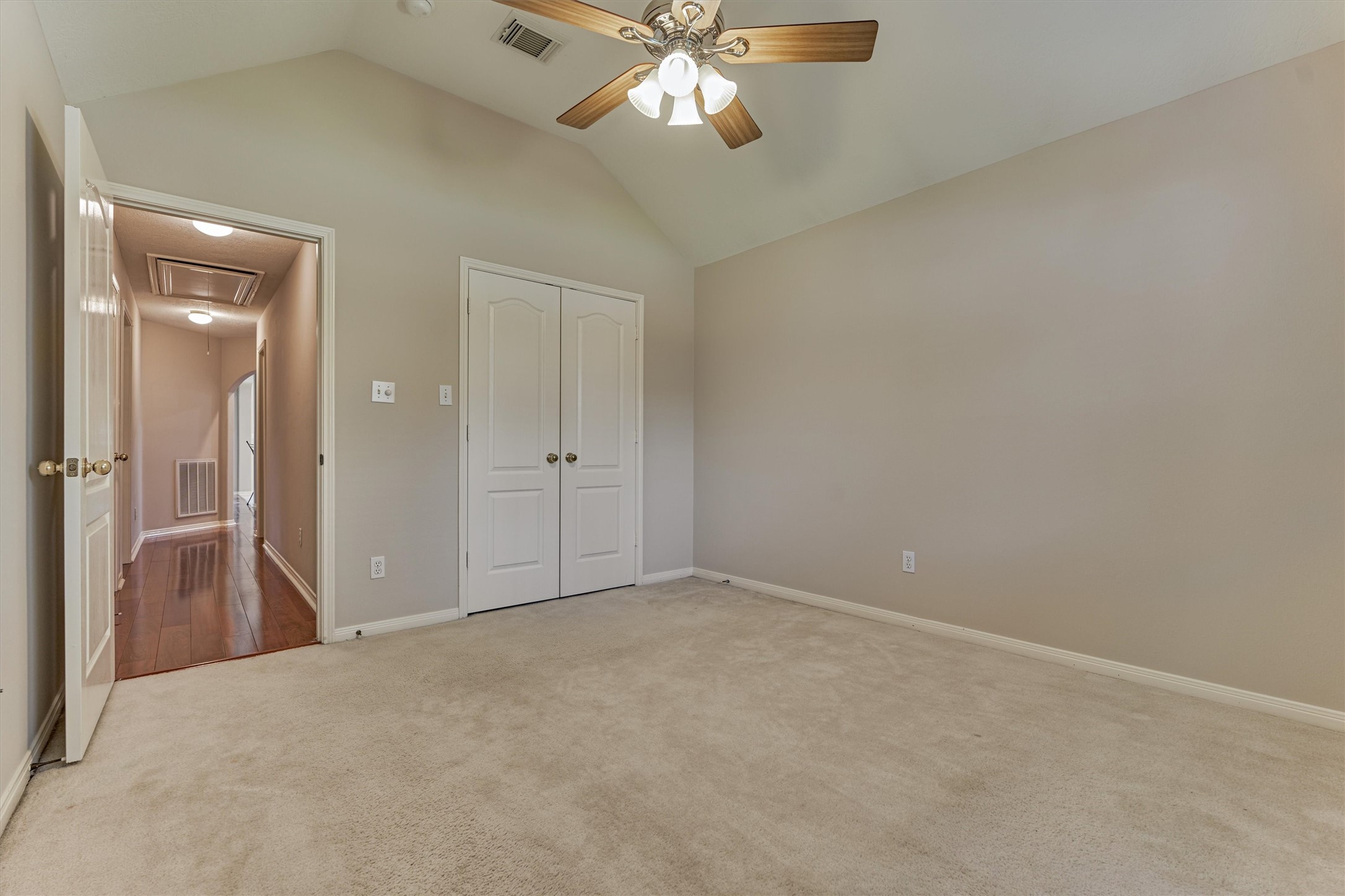930 Arbor Pine Tomball, TX 77375 - Photo 38 of 45 an empty room with closet and a chandelier fan