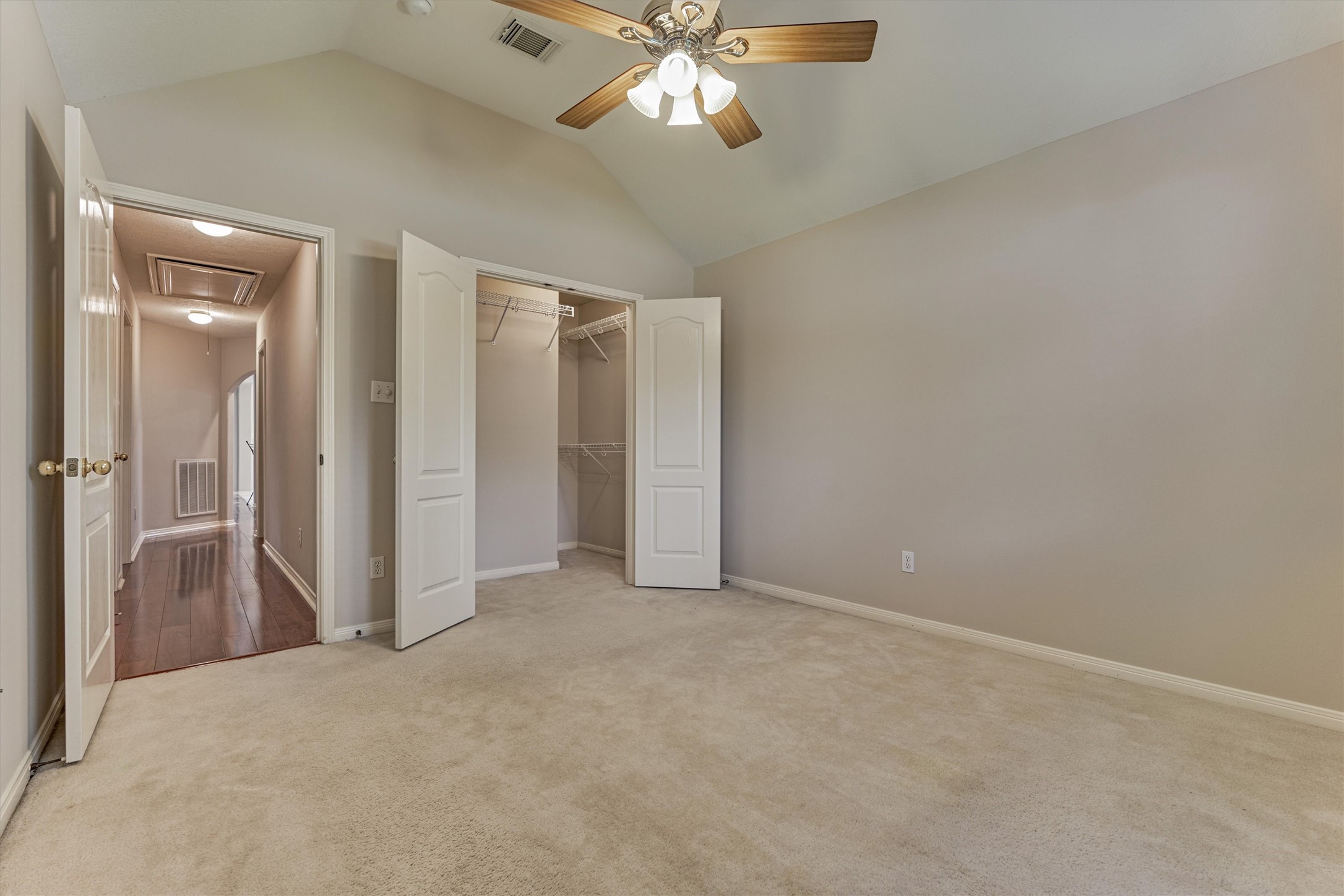 930 Arbor Pine Tomball, TX 77375 - Photo 39 of 45 an empty room with closet and a chandelier fan