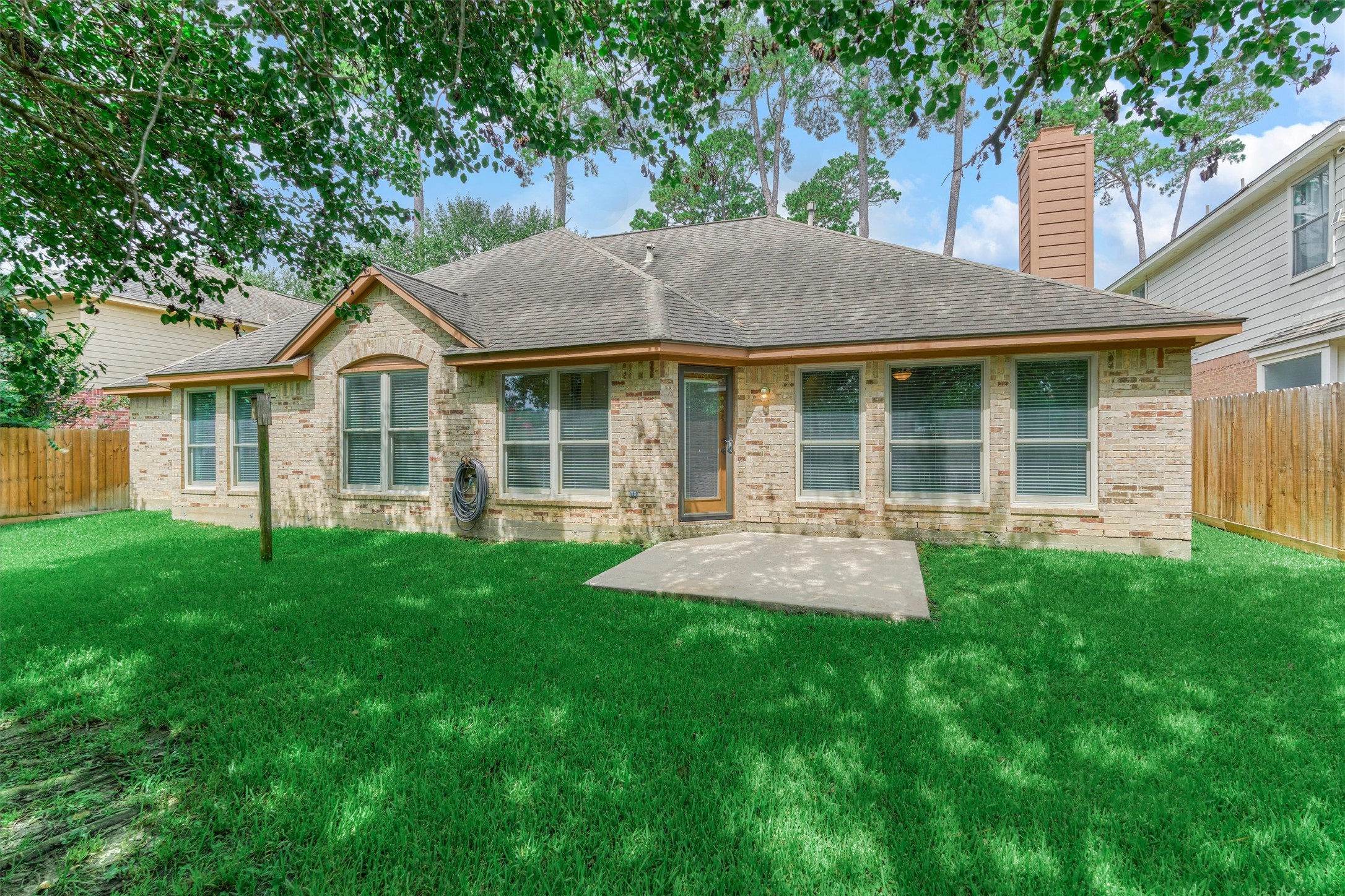 930 Arbor Pine Tomball, TX 77375 - Photo 44 of 45 a front view of a house with a yard and green space