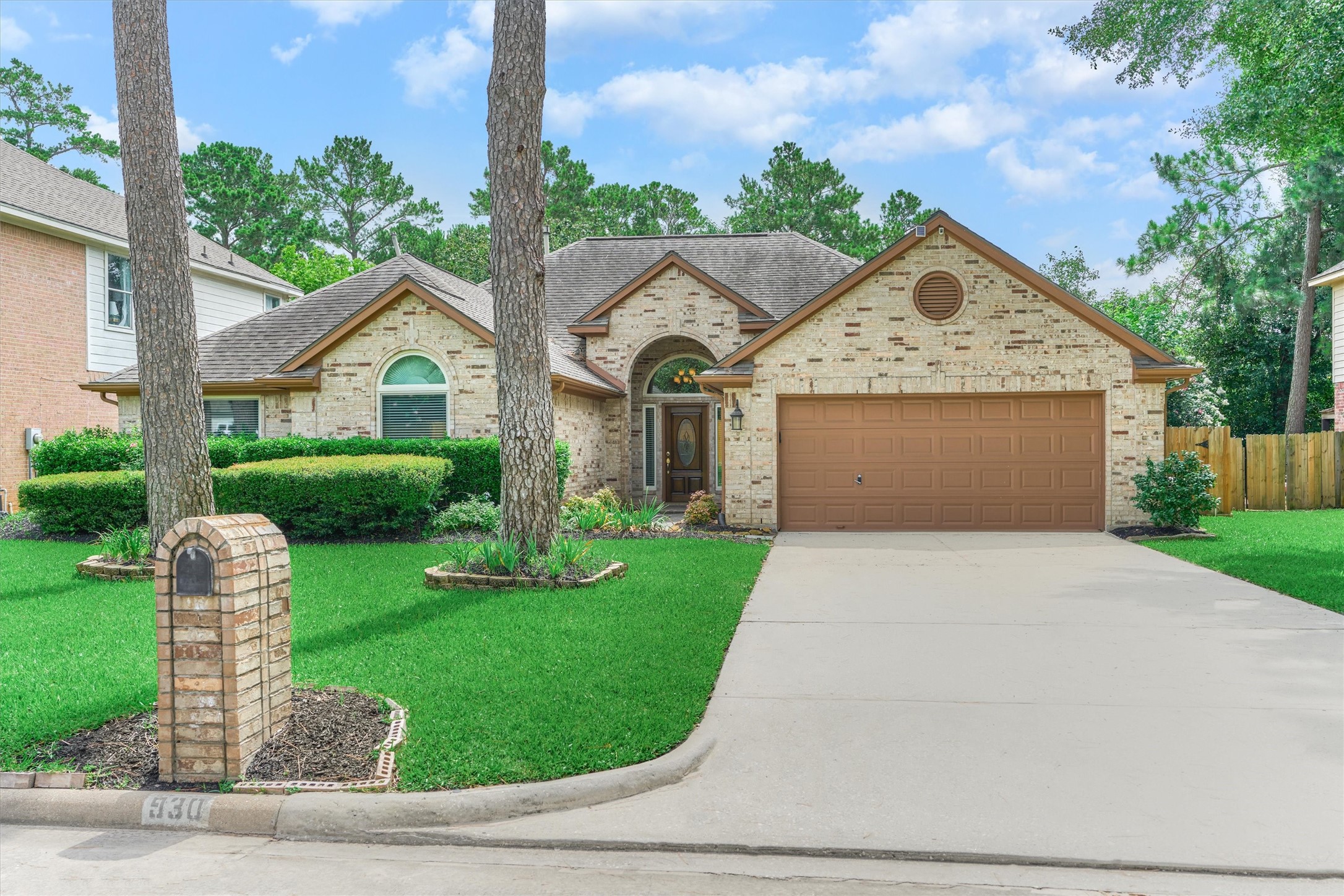 930 Arbor Pine Tomball, TX 77375 - Photo 6 of 45 a front view of a house with garden