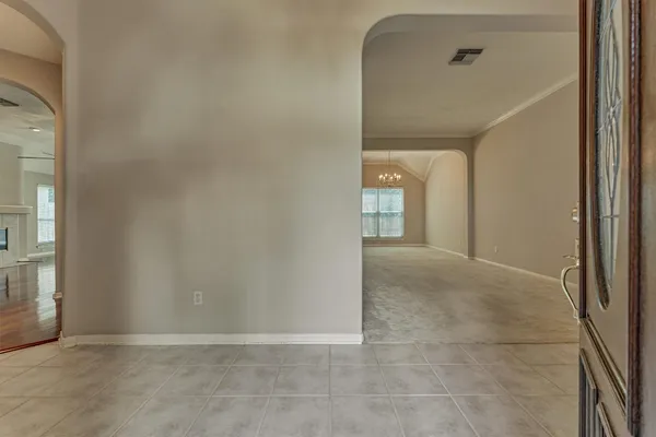 a view of a hallway with a chandelier