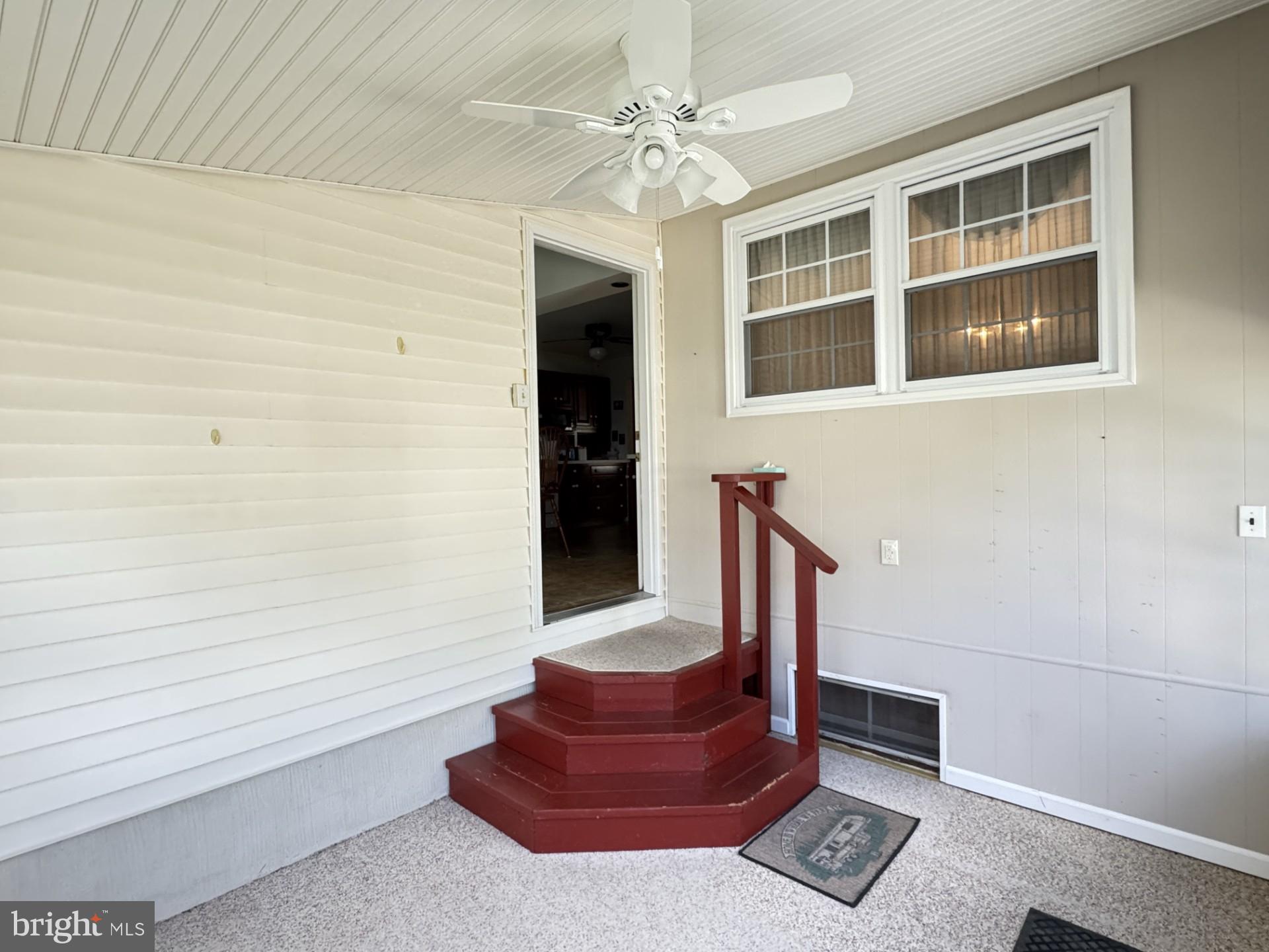 309 Cambridge Road Camden, DE 19934 - Photo 20 of 36 Backdoor entrance through the enclosed porch