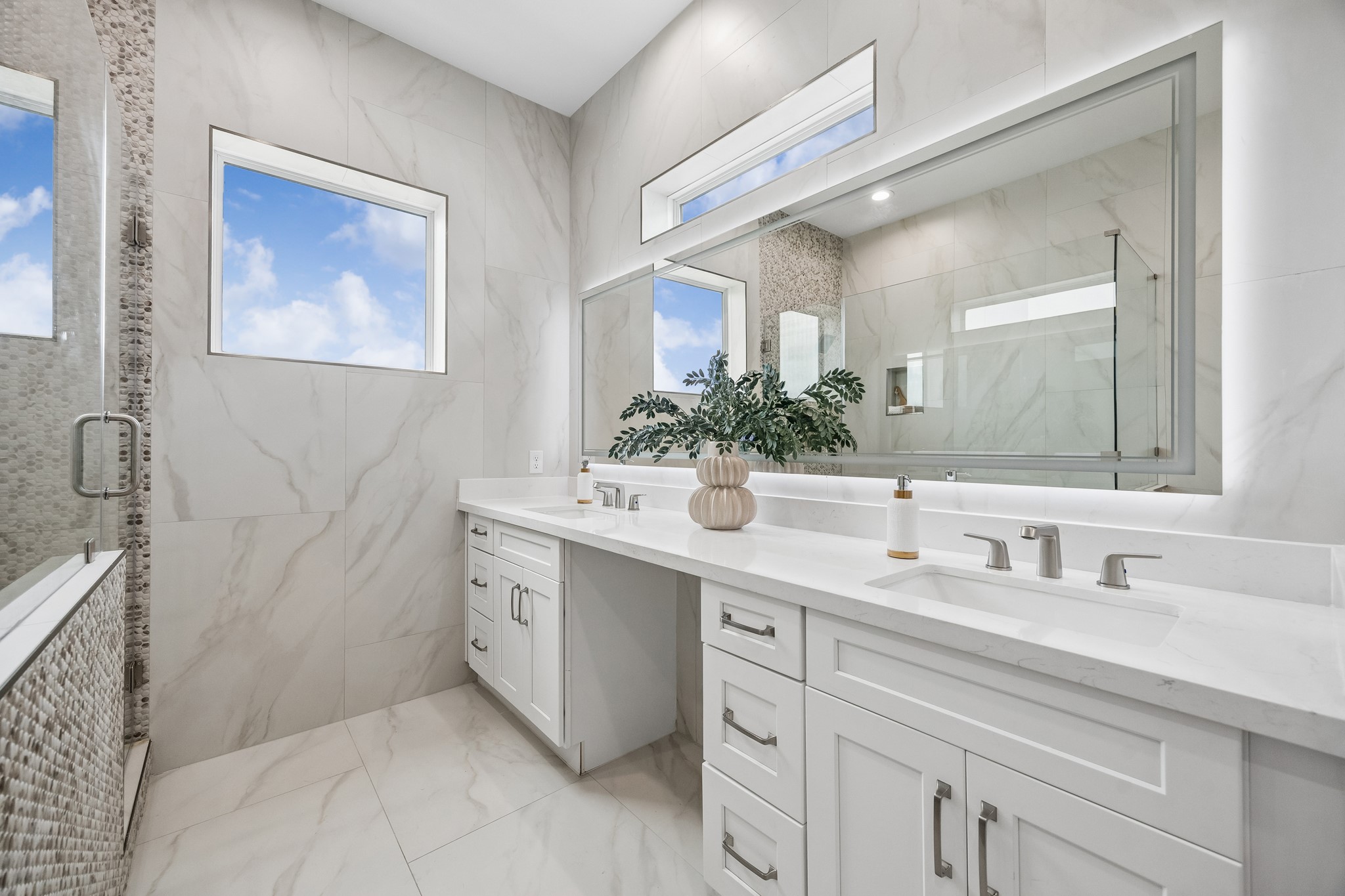 1618 Ojeman Road, Unit A Houston, TX 77055 - Photo 14 of 39 Luxe finishes, quartz counters and dual vanities are featured in the primary bath.