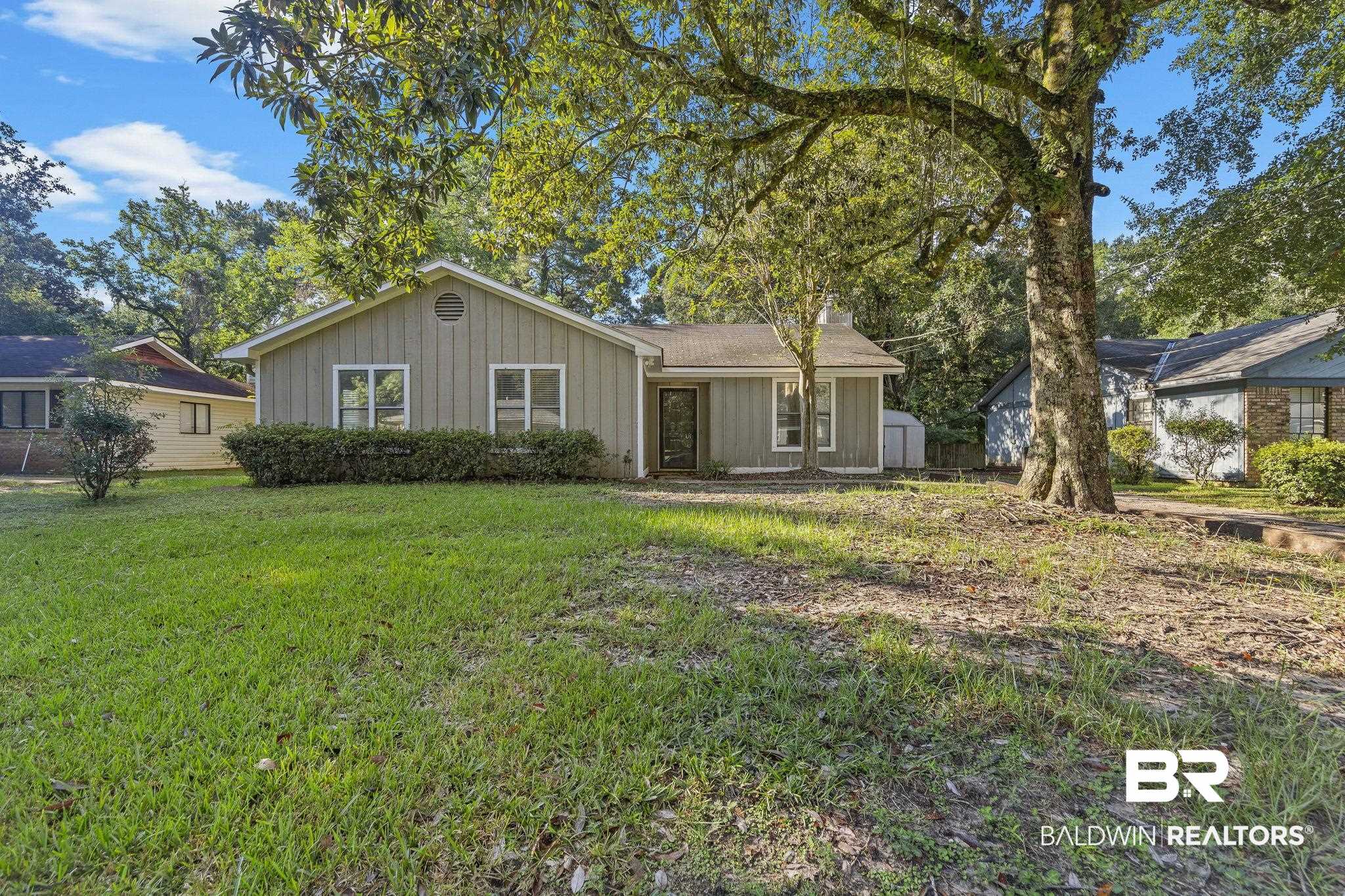 4151 Springdale Road Mobile, AL 36609 - Photo 2 of 21 Rear view of house featuring a lawn