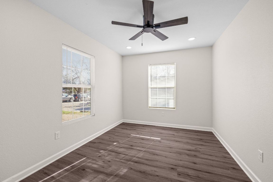 1308 South 45th Street Temple, TX 76504 - Photo 16 of 26 Unfurnished room with dark wood finished floors and ceiling fan