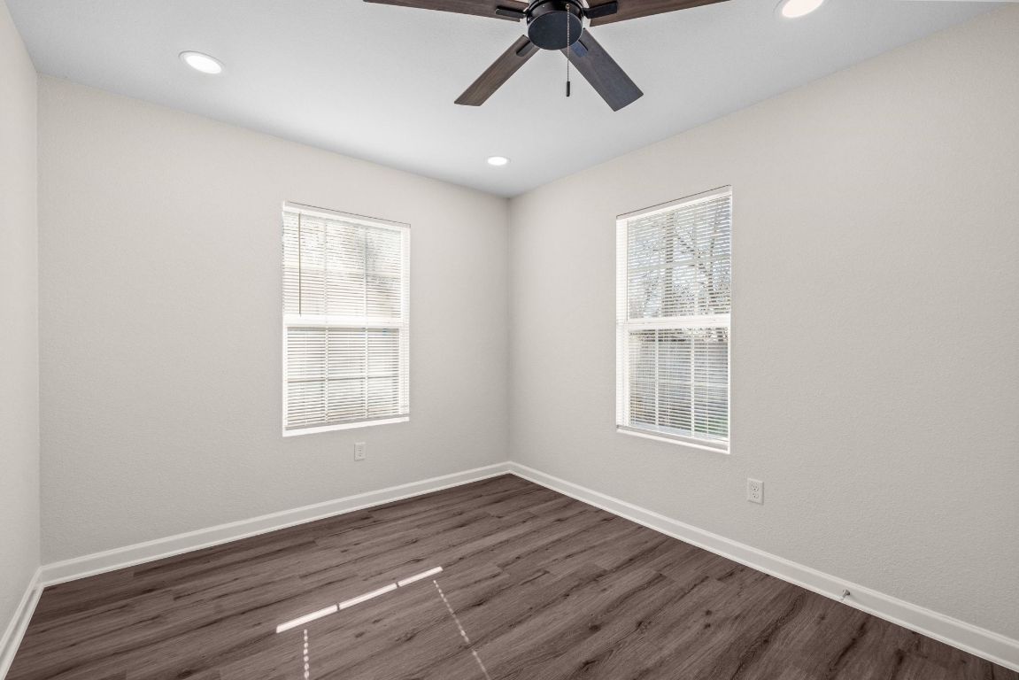 1308 South 45th Street Temple, TX 76504 - Photo 17 of 26 Spare room with dark wood-type flooring, a ceiling fan, and recessed lighting