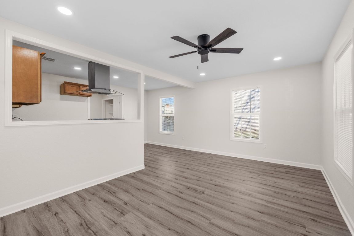 1308 South 45th Street Temple, TX 76504 - Photo 2 of 26 Unfurnished living room featuring dark wood-style floors, recessed lighting, and ceiling fan