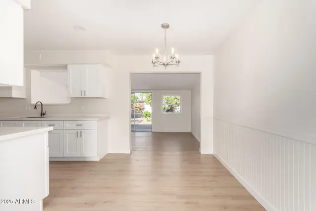 a hallway with sink and window