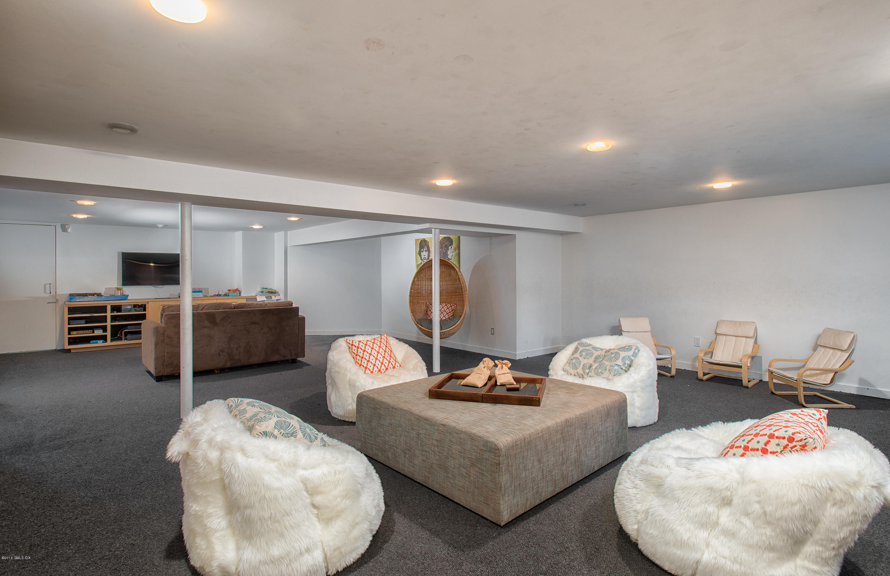 59 Dingletown Road Greenwich, CT 06830 - Photo 12 of 28 a living room with furniture and a mirror