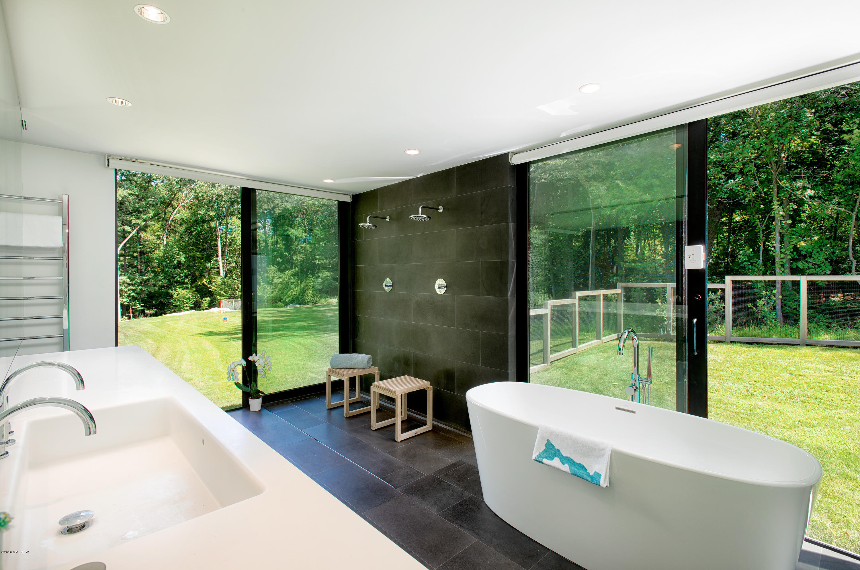 59 Dingletown Road Greenwich, CT 06830 - Photo 13 of 28 a living room with large windows and a table