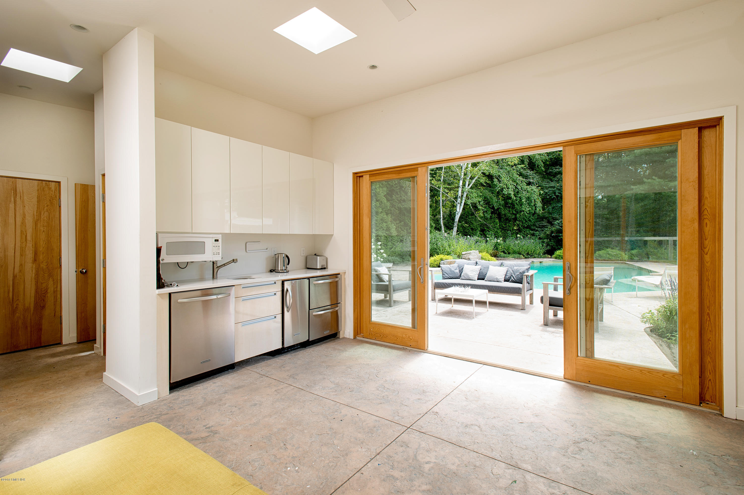 59 Dingletown Road Greenwich, CT 06830 - Photo 15 of 28 a kitchen with a stove a refrigerator and a sink