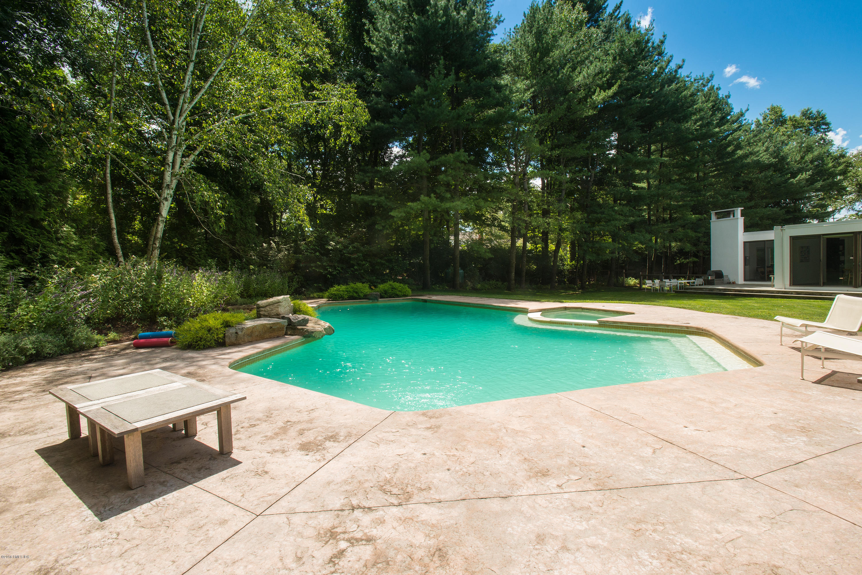 59 Dingletown Road Greenwich, CT 06830 - Photo 16 of 28 a view of a swimming pool with lounge chair