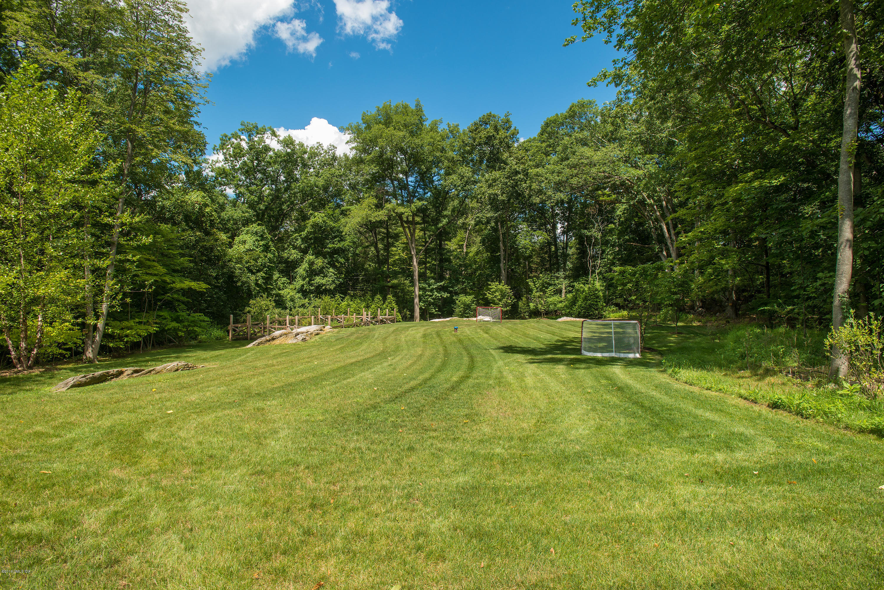 59 Dingletown Road Greenwich, CT 06830 - Photo 19 of 28 a view of a backyard with swimming pool