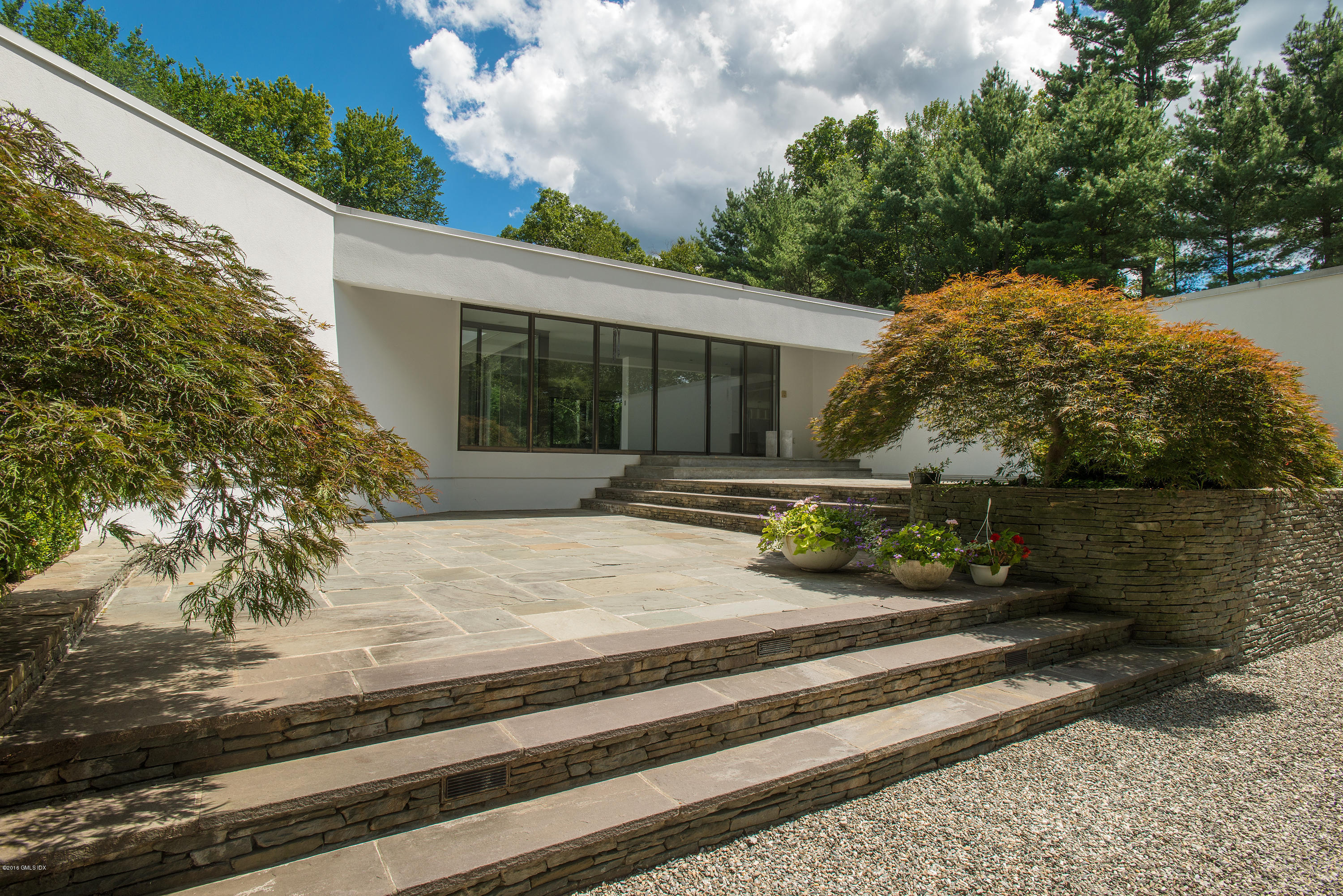 59 Dingletown Road Greenwich, CT 06830 - Photo 20 of 28 a view of a house with a garden