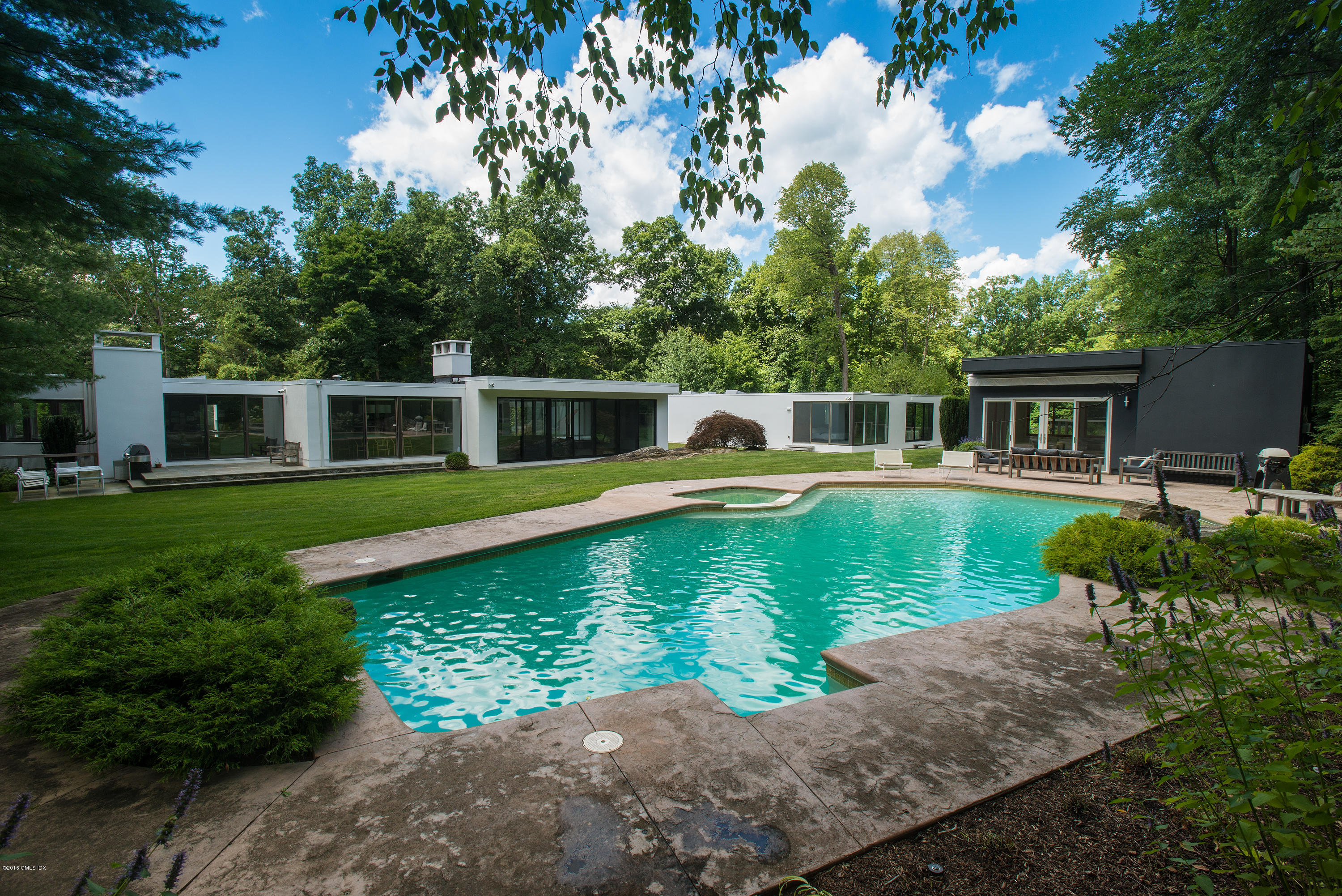 59 Dingletown Road Greenwich, CT 06830 - Photo 2 of 28 a view of a house with a swimming pool