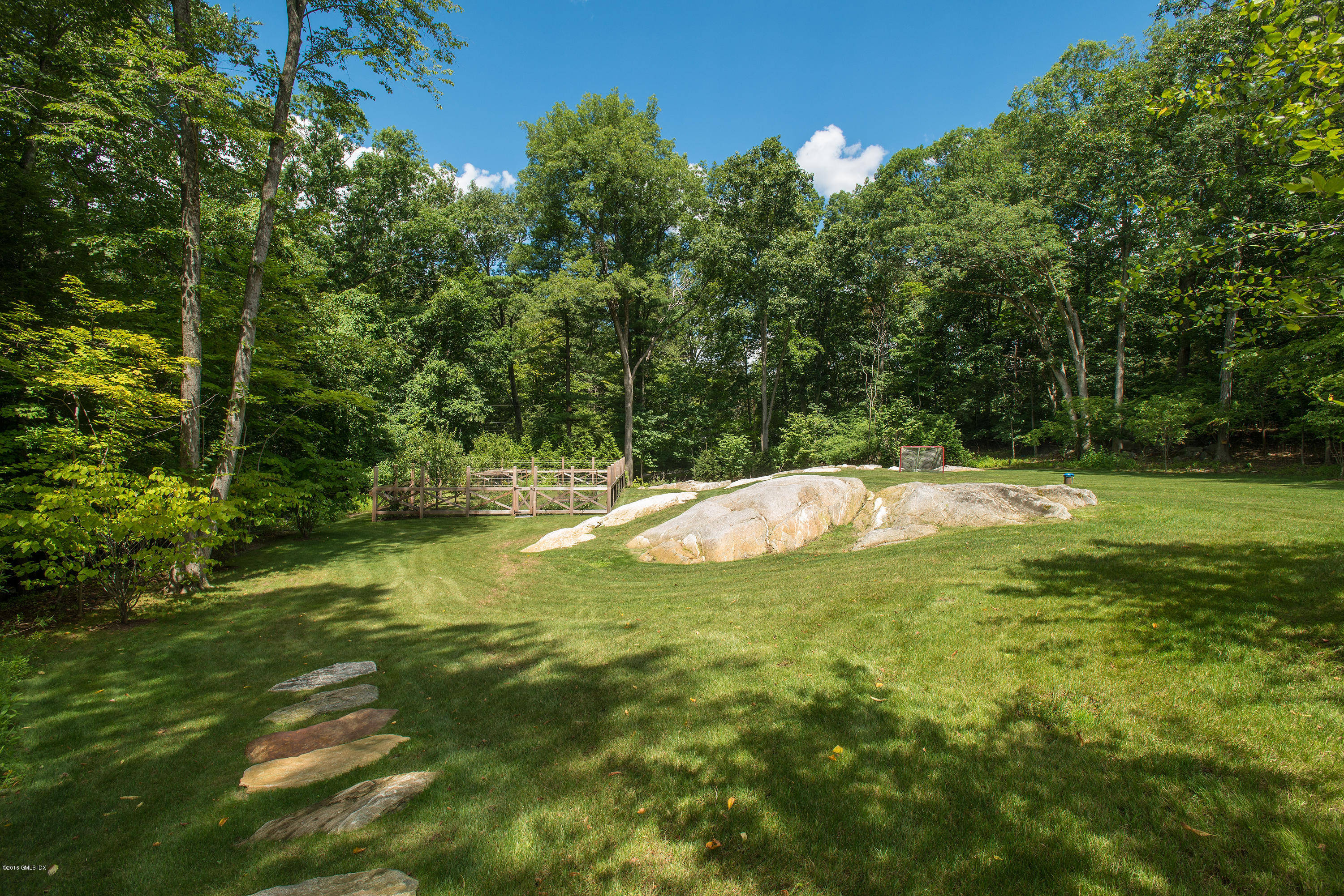 59 Dingletown Road Greenwich, CT 06830 - Photo 24 of 28 a swimming pool with trees in the background