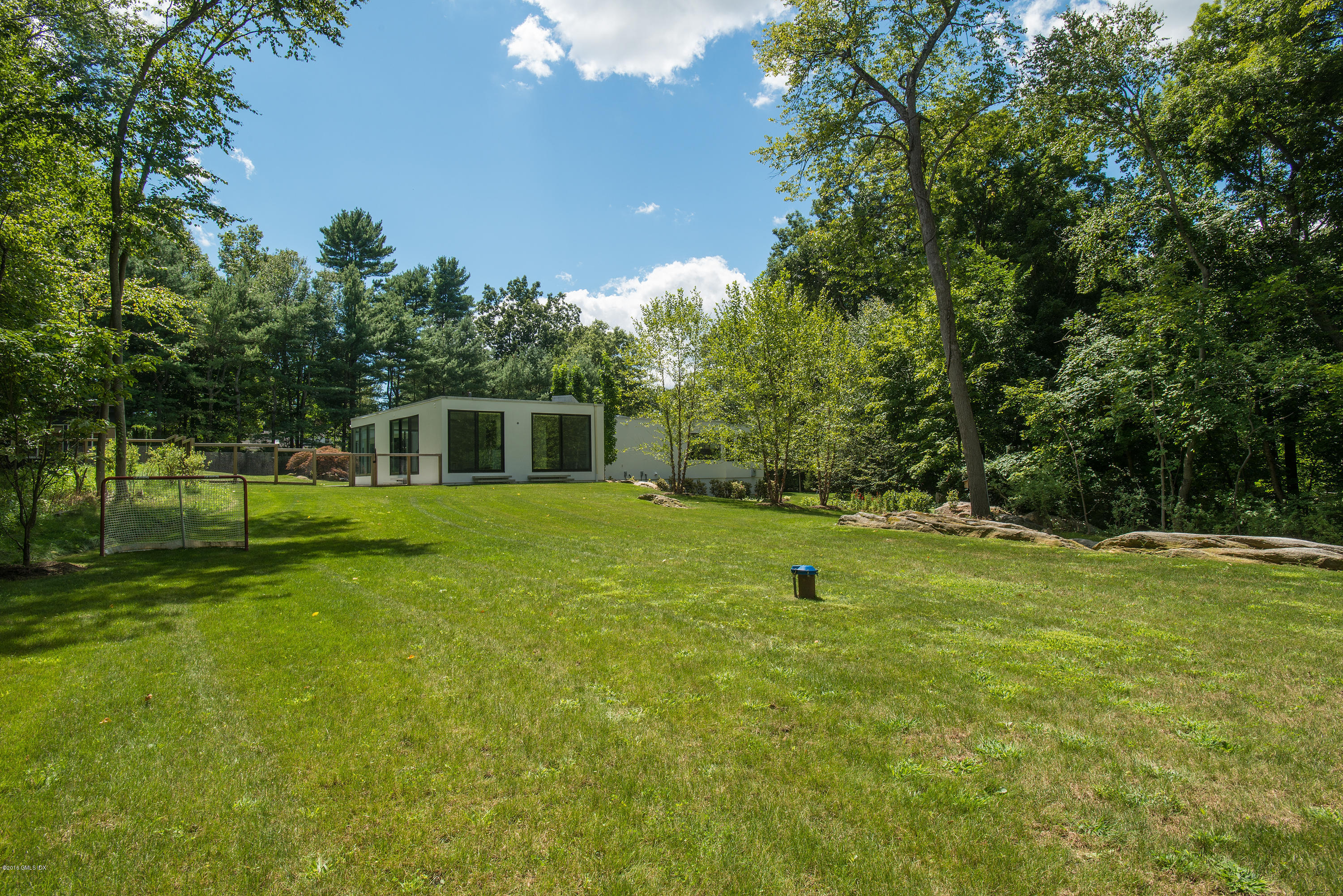 59 Dingletown Road Greenwich, CT 06830 - Photo 26 of 28 a view of a house with a backyard