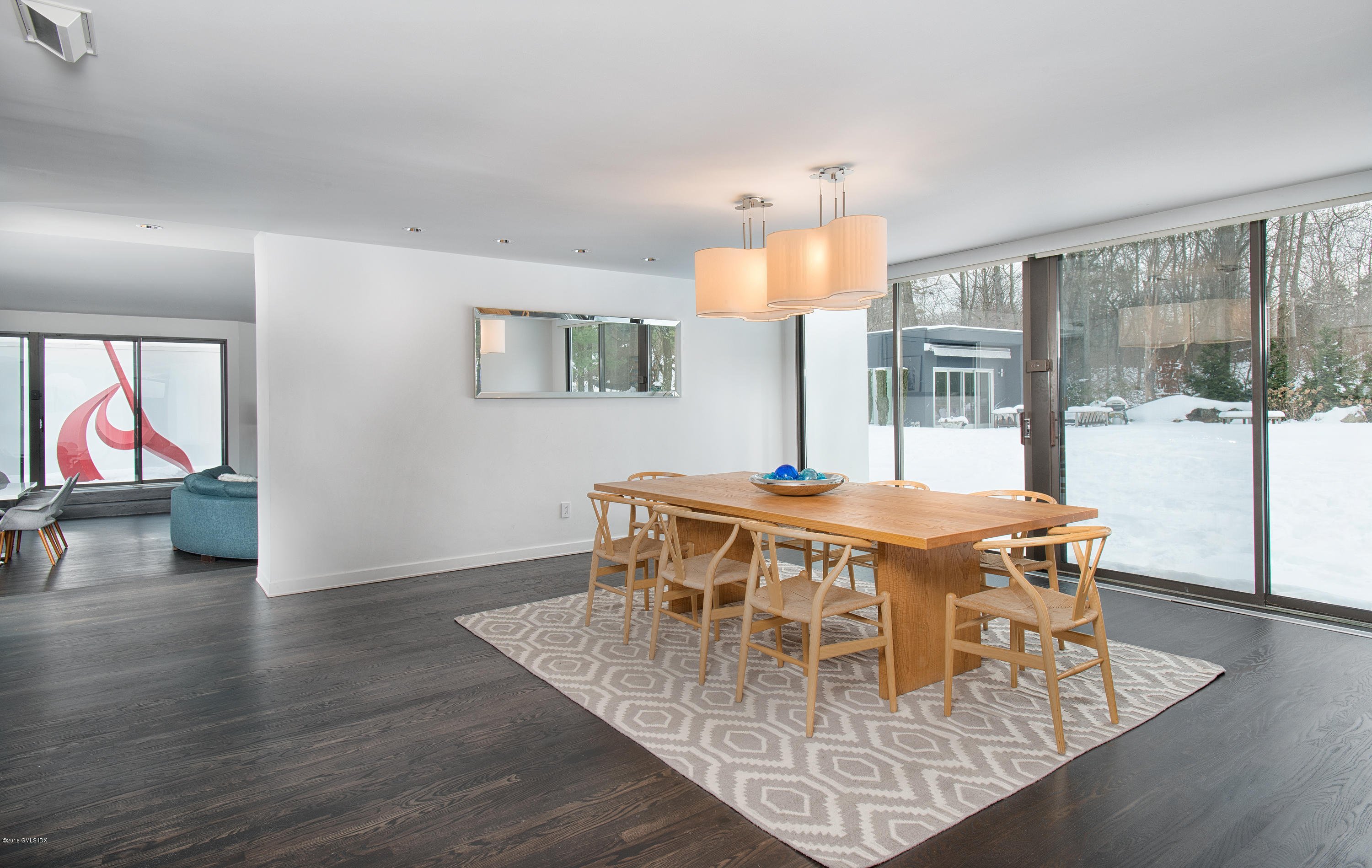 59 Dingletown Road Greenwich, CT 06830 - Photo 7 of 28 a view of a dining room with furniture wooden floor and a chandelier