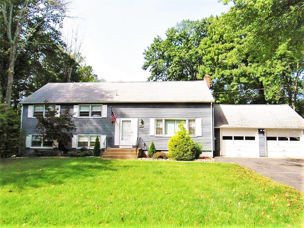 1419 Rhey Avenue Wallingford, CT 06492 - Photo 1 of 1 a view of a house with a yard potted plants and a chair