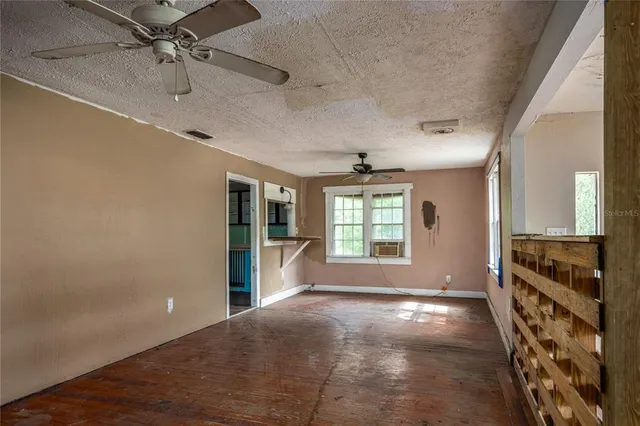 a view of an empty room with a window