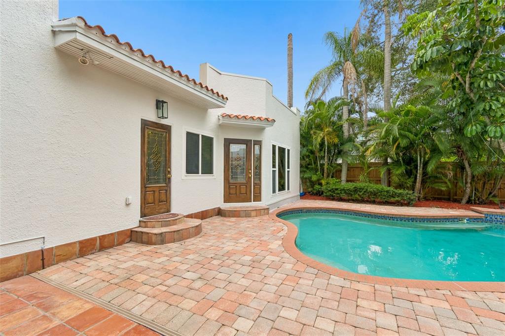 2434 West Prospect Road Tampa, FL 33629 - Photo 28 of 45 a view of a white building with swimming pool in front of it