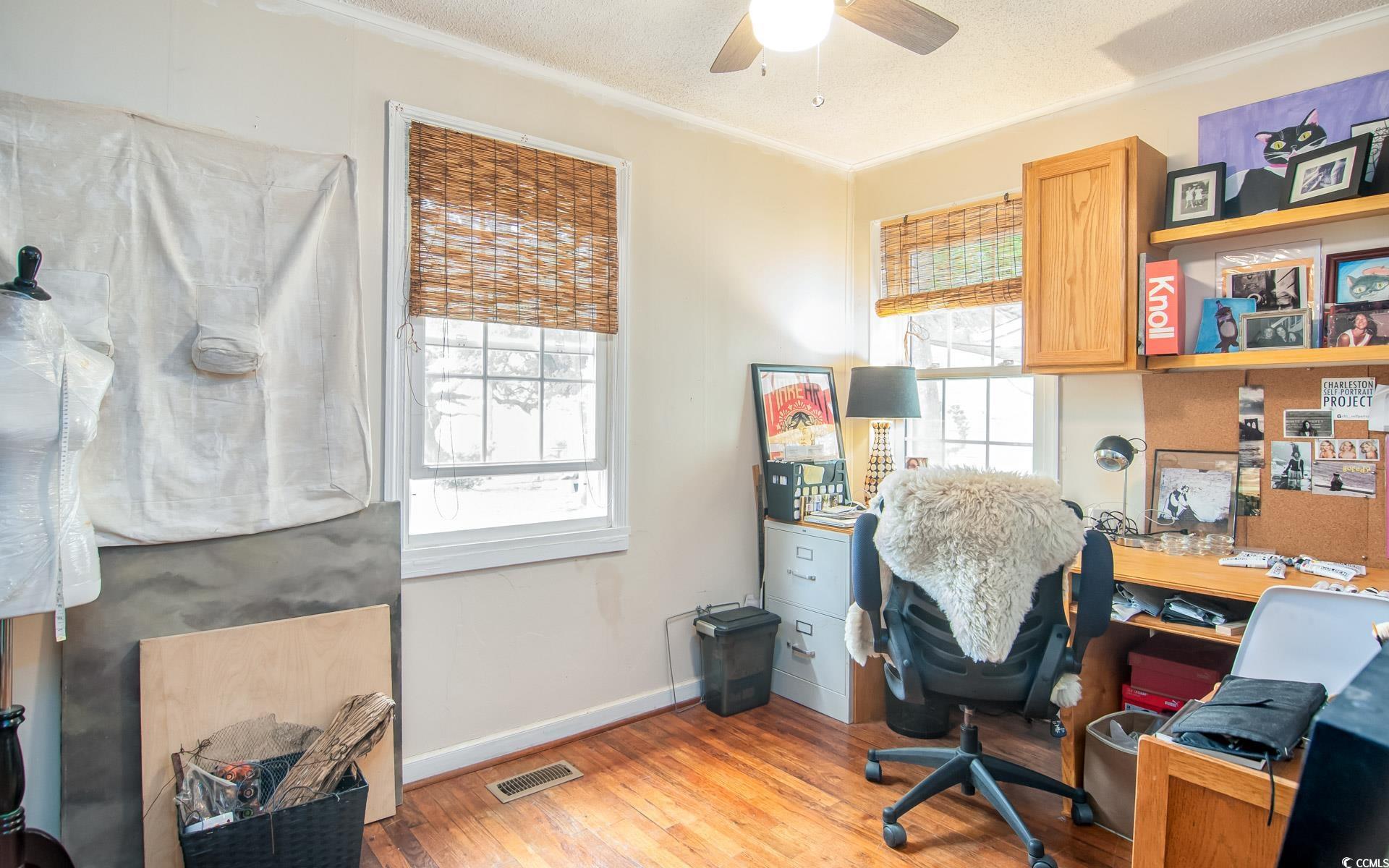 640 Willow Bank Road Georgetown, SC 29440 - Photo 12 of 18 Office area with ceiling fan, light wood-style flooring, ornamental molding, and baseboards