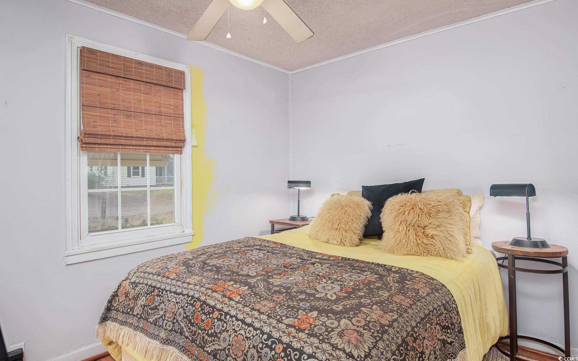 640 Willow Bank Road Georgetown, SC 29440 - Photo 13 of 18 Bedroom featuring crown molding, a textured ceiling, and ceiling fan