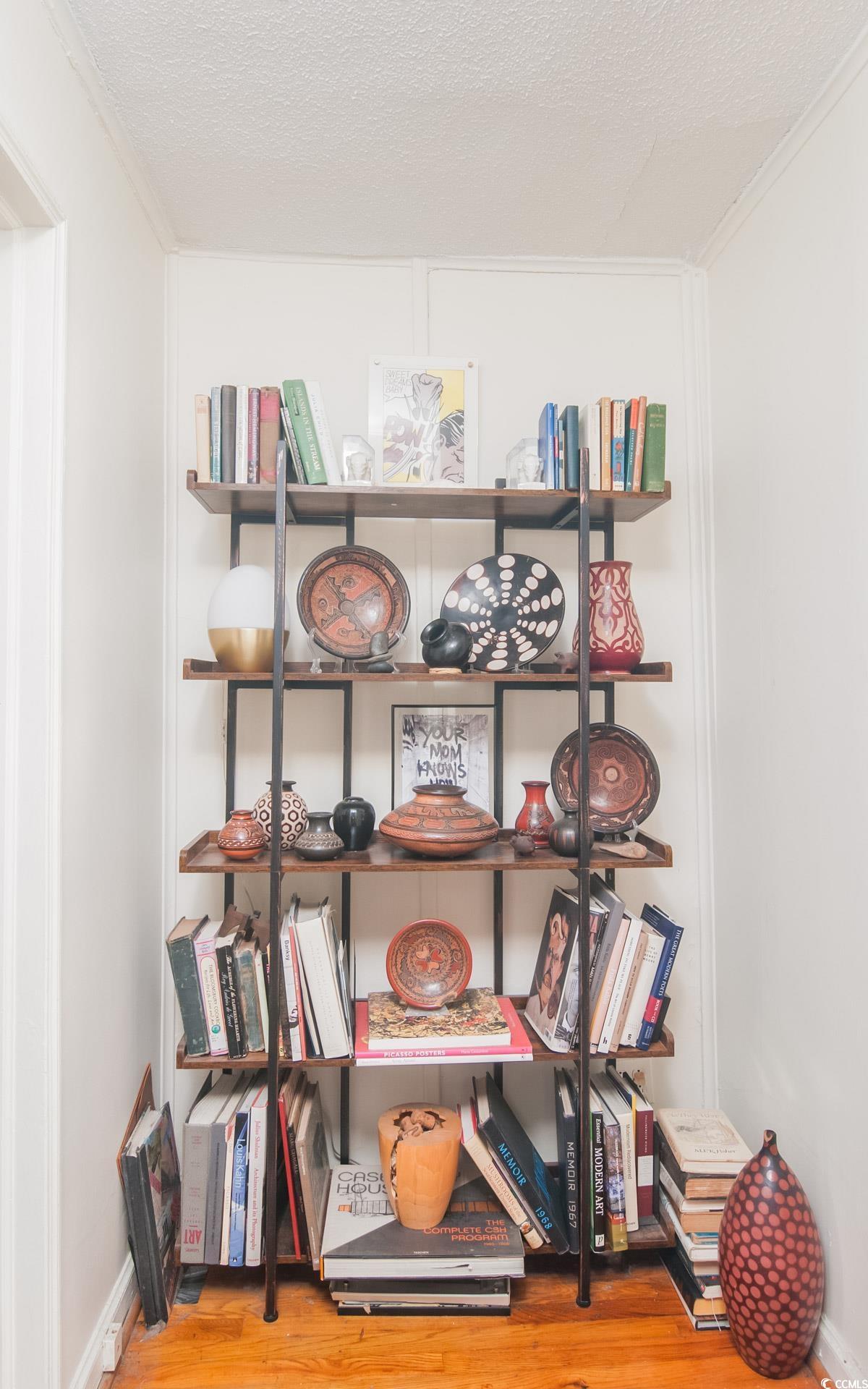 640 Willow Bank Road Georgetown, SC 29440 - Photo 14 of 18 Detailed view of ornamental molding, wood finished floors, and a textured ceiling
